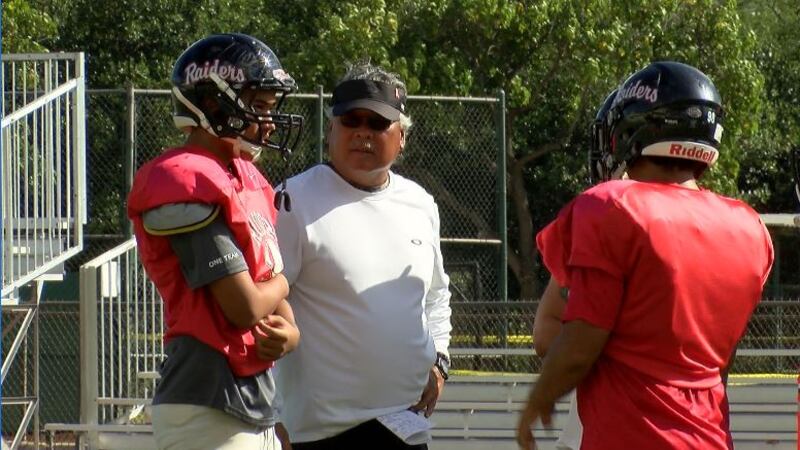 Iolani head coach Wendell Look, looks on at Raider practice on Tuesday.