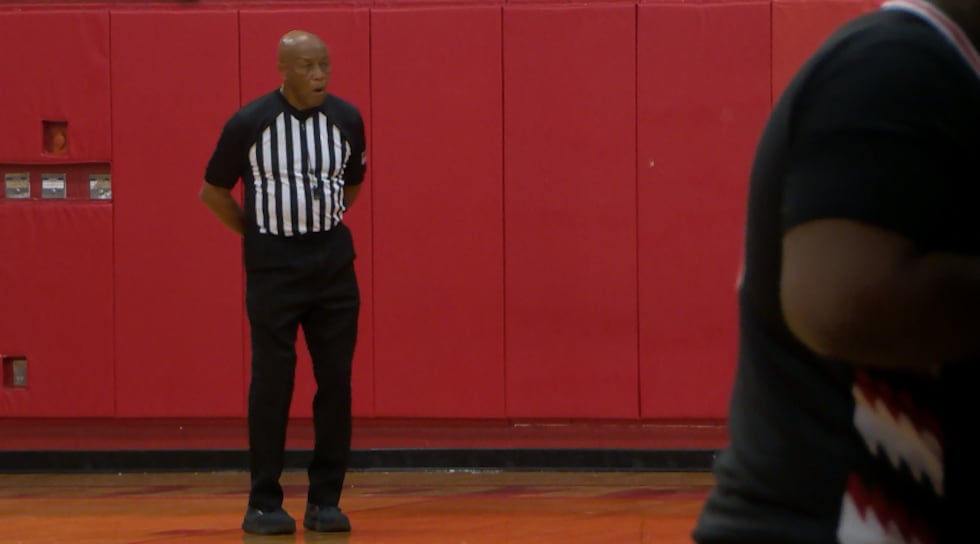 James Wilson looks on during a timeout of a regular season game between Charlotte Catholic and...