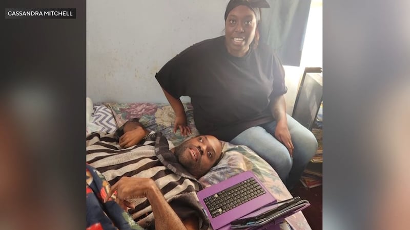 Justin Mitchell, who had cerebral palsy, is pictured with his aunt, Cassandra Mitchell. He and...