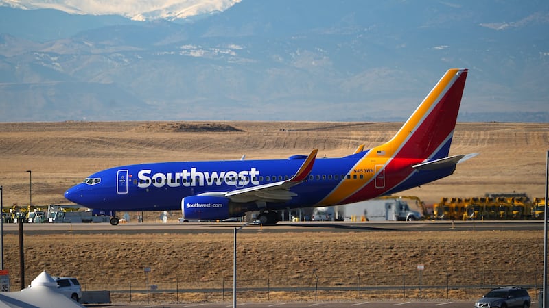 Southwest Airlines jetliner taxis down a runway for take off at Denver International Airport,...